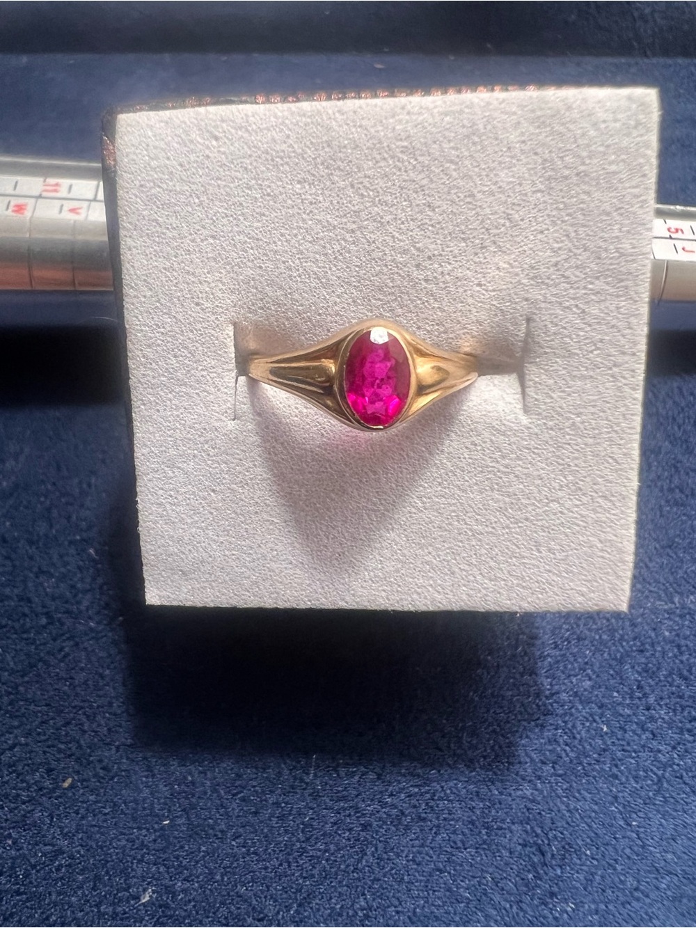 10kt gold ring with red oval stone. Size 3